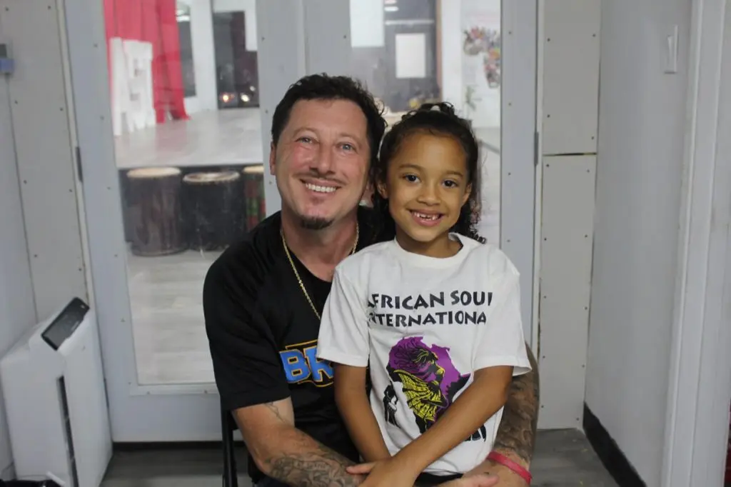 Maxwell Pickens, and daughter after the showcase. Photo by Marion Apio